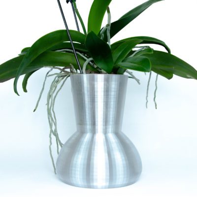 automatic orchid watering system with an orchid inside
